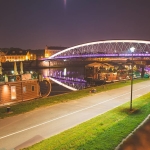 Our first night in Krakow, we walked to the Wisła river to see the Kładka Ojca Bernatka (Father Bernatek Footbridge) lit up after dark. The bridge was finished in 2010 and is quickly filling up with lover's locks, so we thought this was going to be a big tourist attraction. But there was no one there but us, the spiders attracted to the lights on the bridge, and nine acrobatic figures by Polish artist Jerzy ‘Jotki’ Kędziora that seem to be balancing in midair over the water.