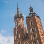 St. Mary's Basilica in Kraków's town center is famous for the trumpeter that plays from the window of its taller tower every hour and the fact that he abruptly stops mid-song in the same way a 13th century trumpeter did when he tried to warn the city that the Mongols were coming but got an arrow to the throat through the tower window before he finished his call.