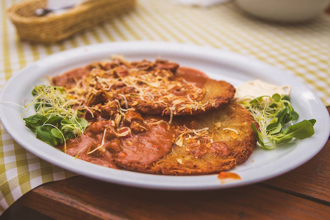 In Zakopane, we ate lunch outside on the patio at Karczma Bacówka along Krupówki, the famous promenade in the center of town. We had bacon-wrapped dates, sauerkraut soup, pierogies, and these placki ziemniaczane (potato pancakes) covered in goulash and cheese.