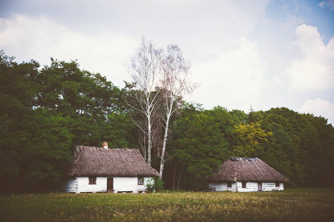 Historic thatched-roof manor houses outside of Warsaw, Poland.