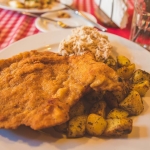 After arriving at our Airbnb in Krakow (the top floor of a beautifully renovated building with remote-controlled shades over the skylights for $60/night!), we obviously immediately went to eat. Luckily, one of the three Warsztat cafes was right across the street from us, with huge portions of traditional Polish food. I got my first of, like, ten kotlet schabowy, which is a huge pork cutlet that's been pounded flat, breaded, and fried. Mine came with fried potatoes and apple slaw, and of course I also got pierogies, so when I had ten pounds of leftovers, the restaurant put them in plastic containers and vacuum sealed them for freshness. What?! Poland is amazing.