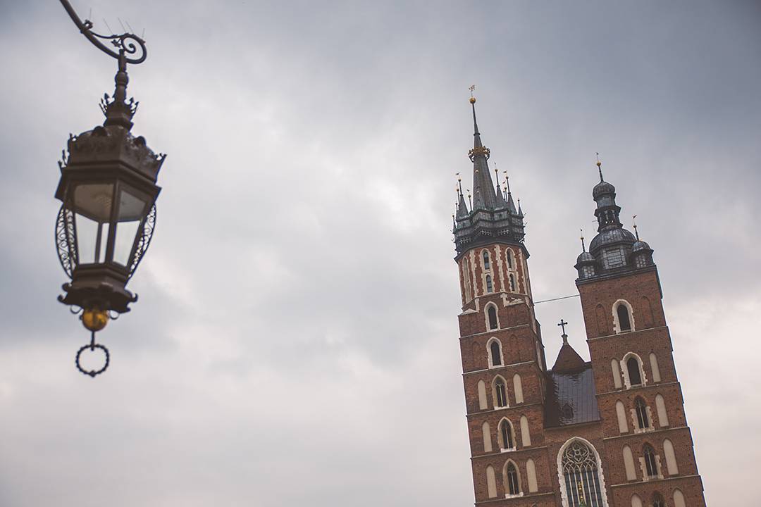 It rained our last full day in Poland, so here we are in the Kraków town center under the roof of the Sukiennice, trying to keep dry and watching the horse-drawn carriages ferry people around in their ponchos. They always have an attractive younger woman and a sturdy-looking old man driving the carriage, and we decided it's because wives want the carriage ride and can only be convinced to take one by the idea of sitting behind the hot chick.
